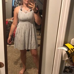 Super cute stripped dress with floral detail!